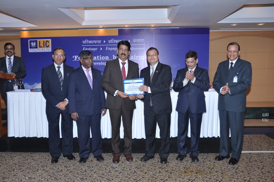 Receiving honours from LIC MD.